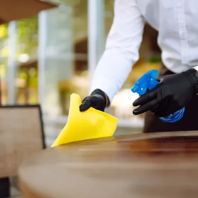 disinfecting-to-prevent-covid-19-waiter-cleaning-2023-01-19-03-37-40-utc